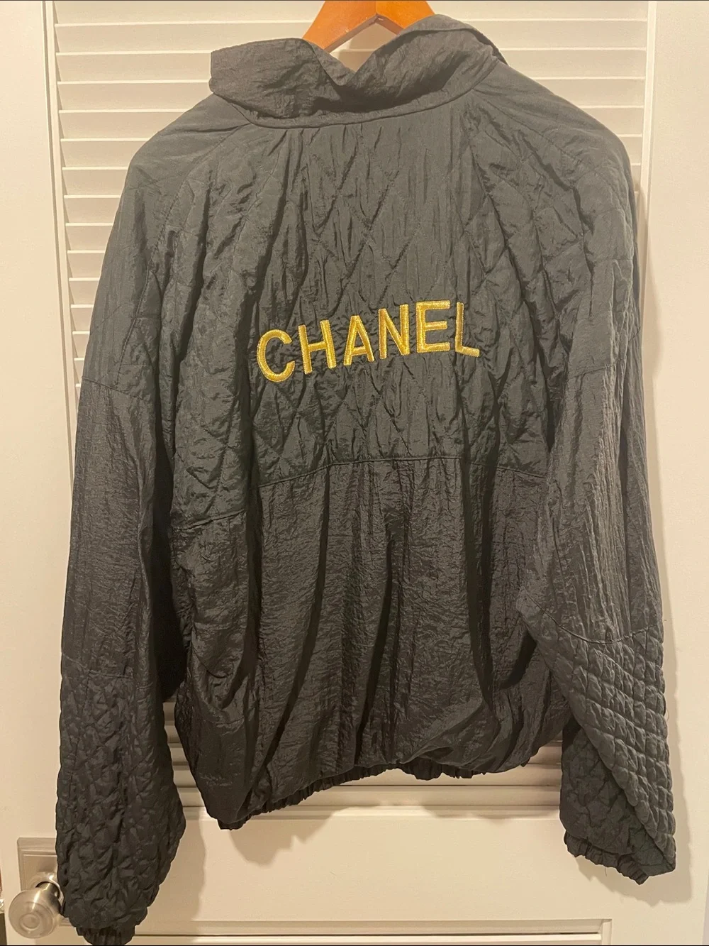 CHANEL Black Quilted Hooded Windbreaker with Gold Logo